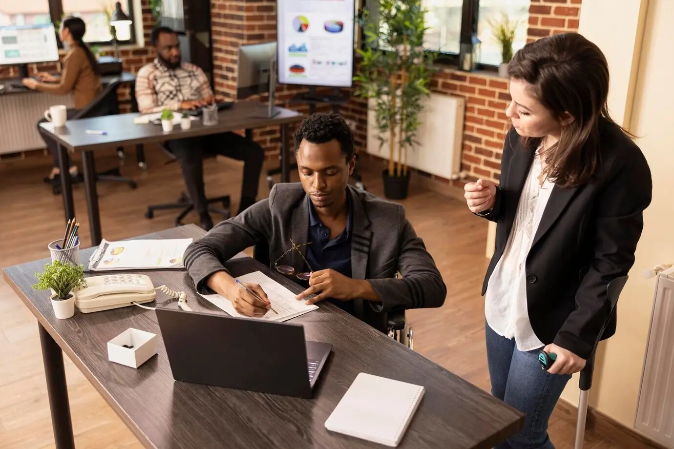 A diverse group of colleagues discusses strategy ideas.